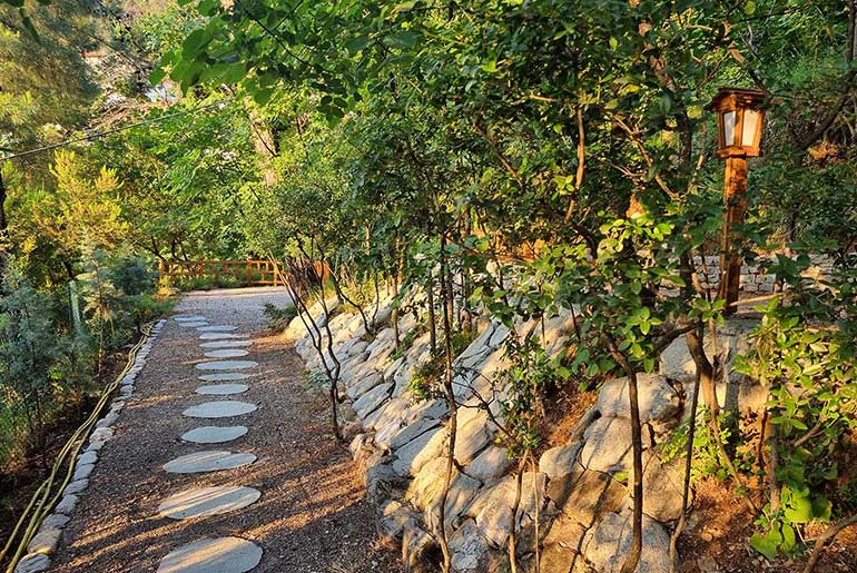 Stone walkway in the garden of Villa Dimitra