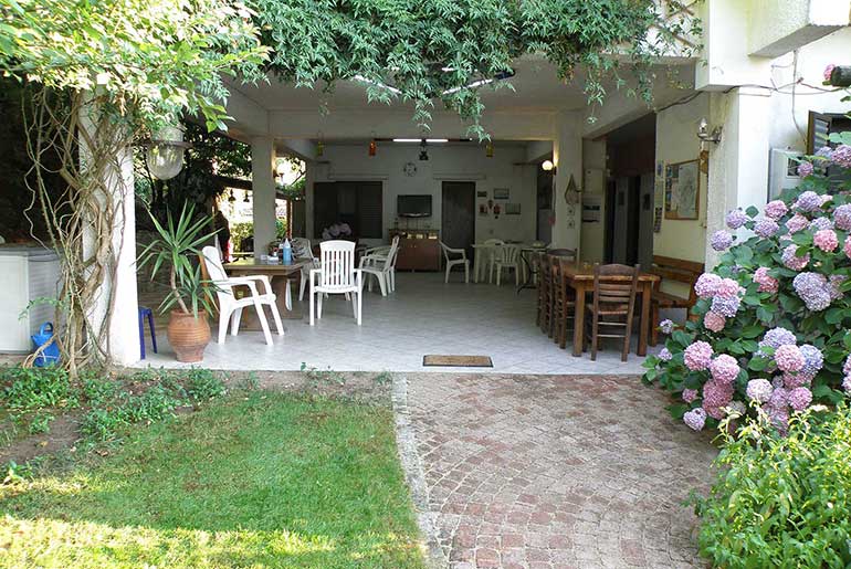 Common area with tables at Villa Dimitra in Thassos